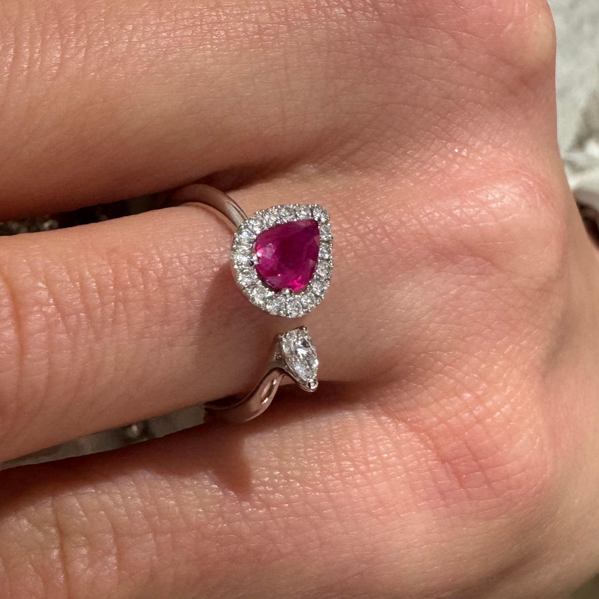 Open ring with ruby drop and white gold diamonds