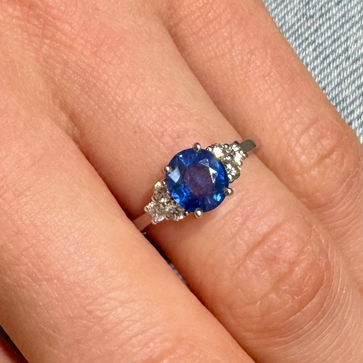 White gold ring with oval cut sapphire