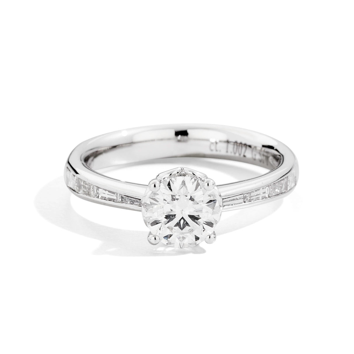Anello Solitario 0.705kt con diamanti baguette 0.30kt