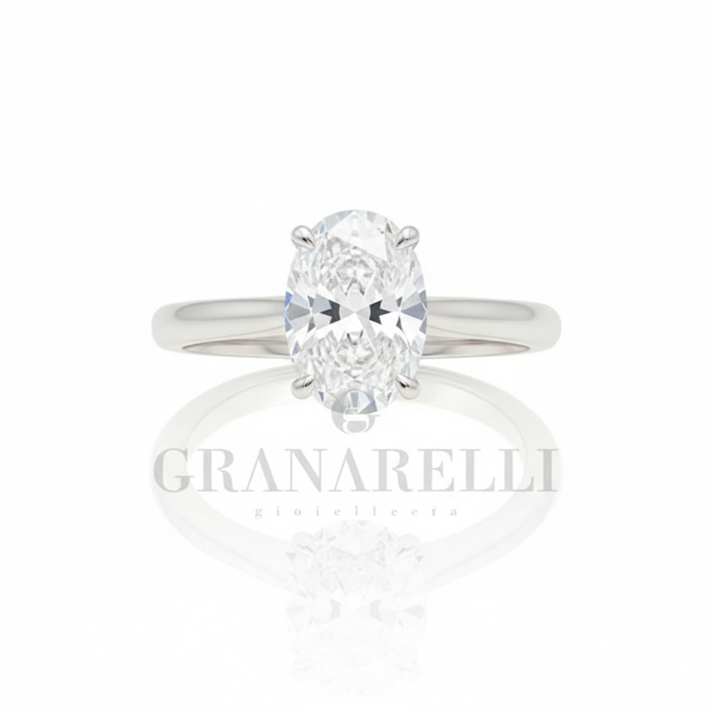 Anello solitario diamante ovale griffe arrotondate