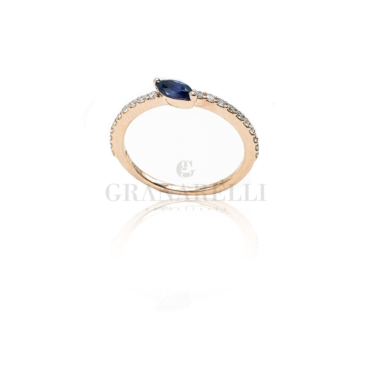 White diamond ring and central blue sapphire