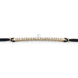 Bracciale barretta misura media diamanti bianchi su cordino nautico nero in oro giallo