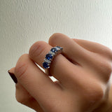 White gold stone ring with 4 oval sapphires and diamonds