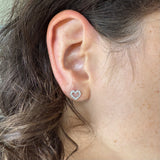 Silhouette heart earrings in white gold and diamonds