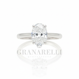 Anello solitario diamante ovale griffe arrotondate