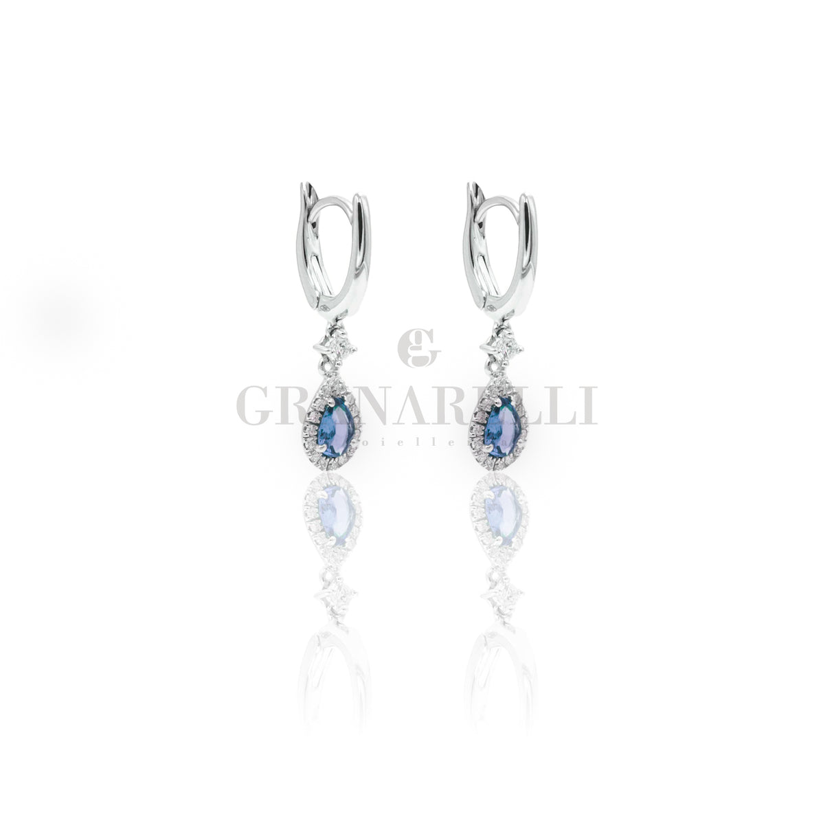 Boccola con goccia di zaffiri 0,82ct contorno diamanti in oro bianco