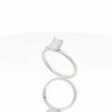 Ring solitaire emerald cut diamond white gold angled