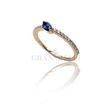 White diamond ring and central blue sapphire